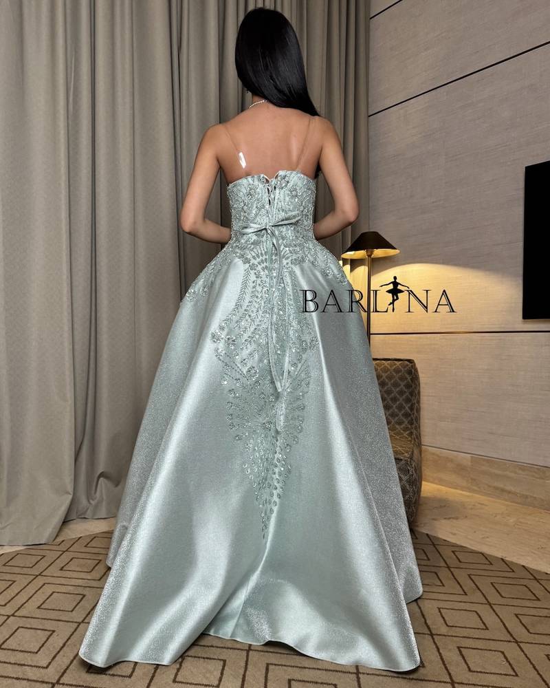 Light green dress with elaborate floral motifs
