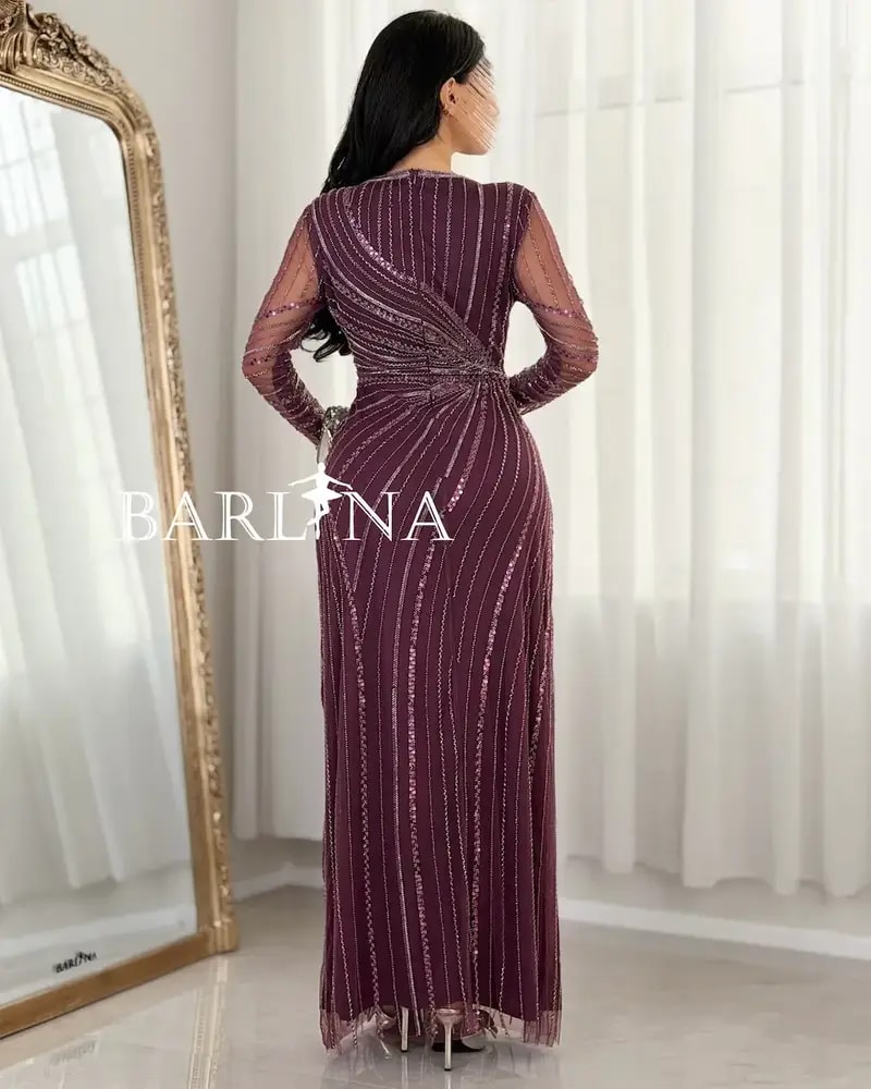 Elegant evening dress adorned with shimmering embroidery lines