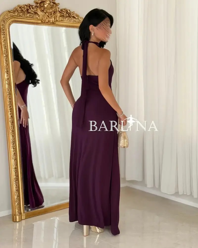 A purple dress with a fitted silhouette and a high neckline.