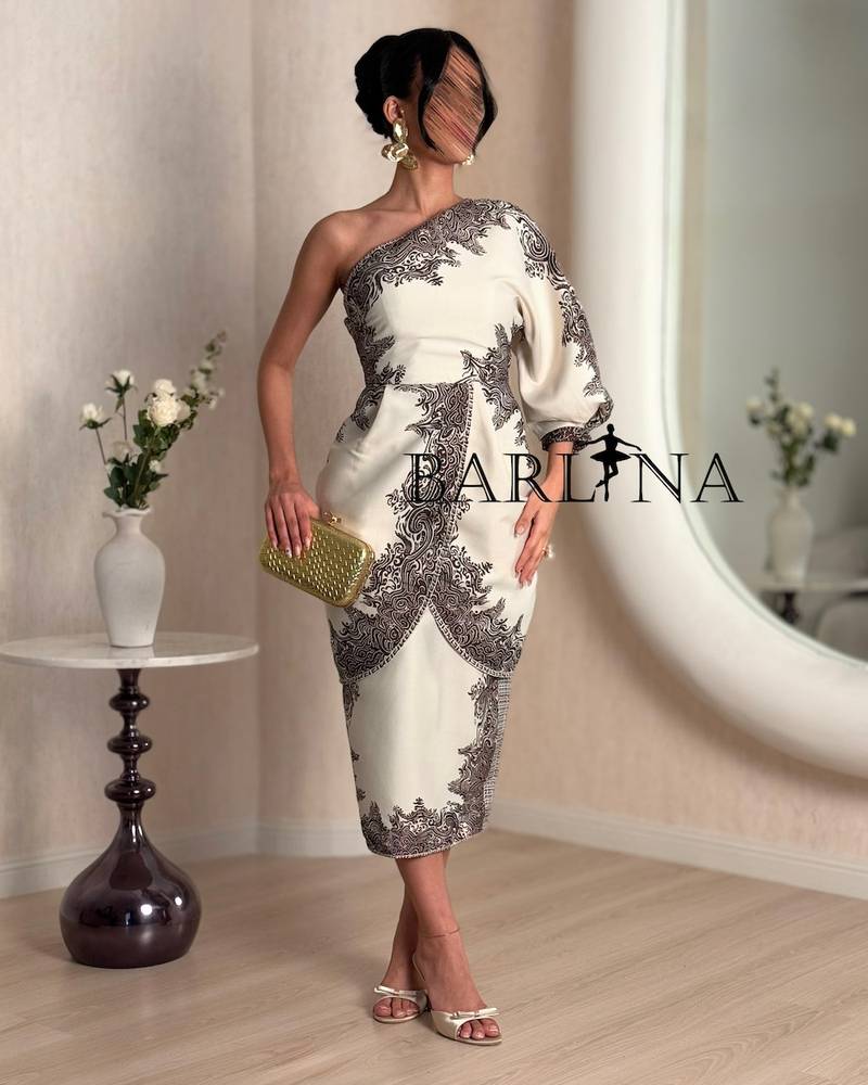A distinctive one-shoulder dress with decorative patterns