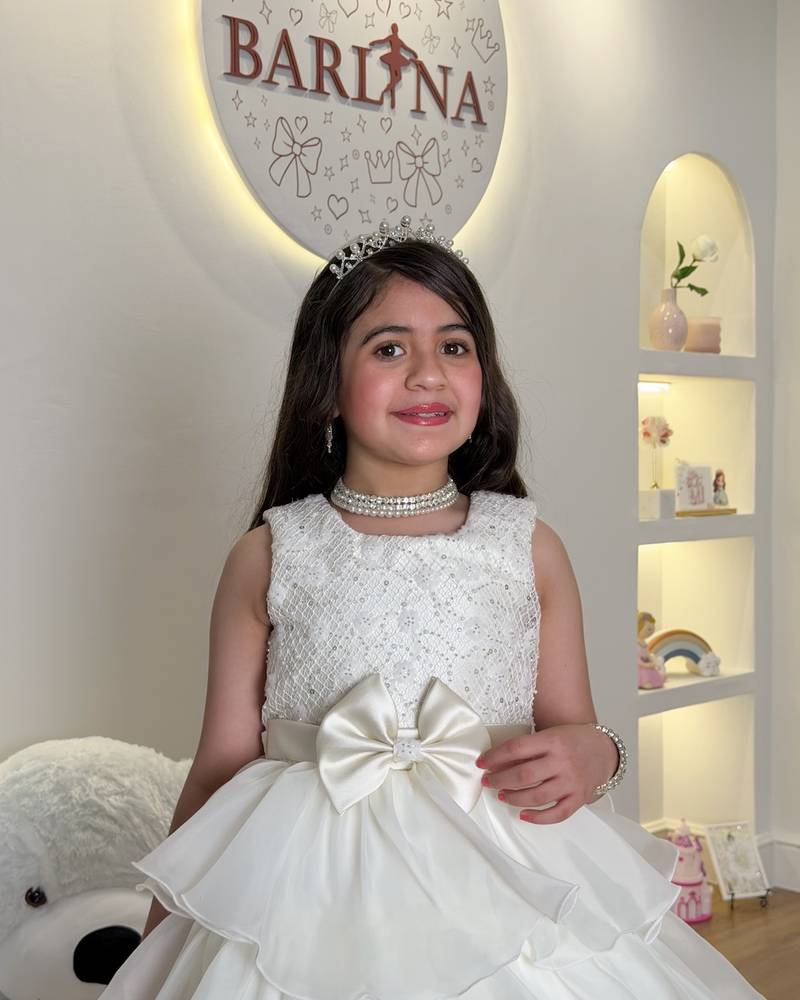 Girls' dress with puffy cream-colored layers