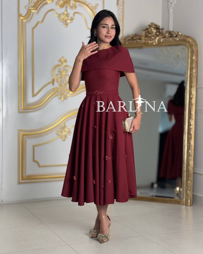 Loose burgundy dress with a covered neckline