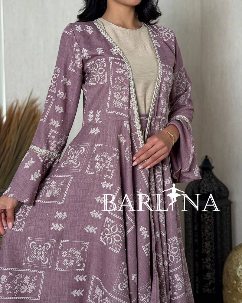 Purple jalabiya with patterns and a slanted hem