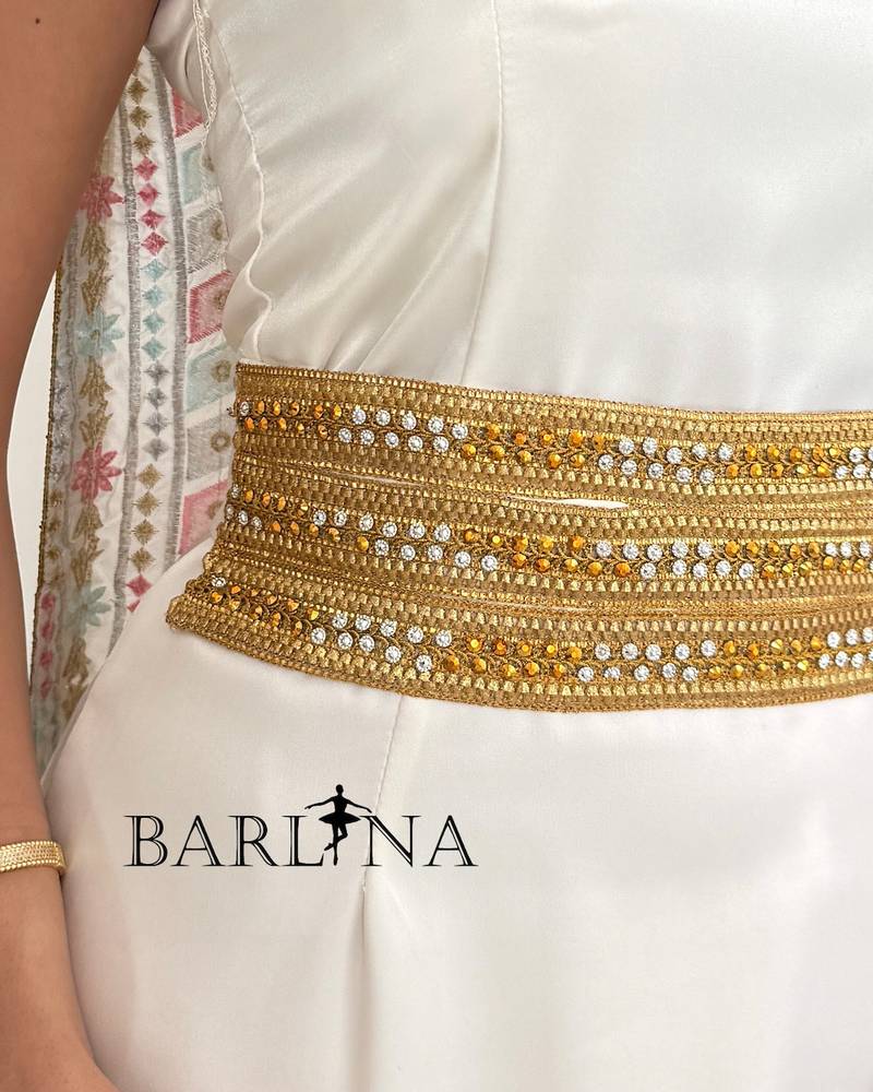 A soft white jalabiya with a gold embroidered belt