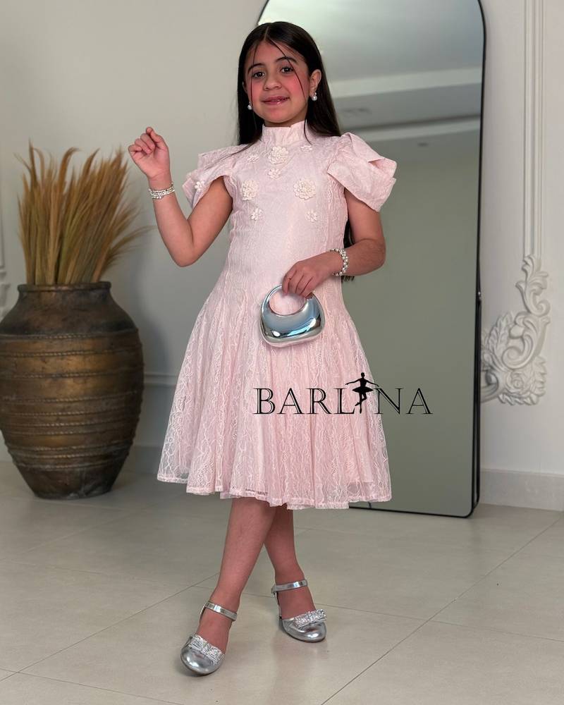 A soft girls’ lace dress with a feminine design