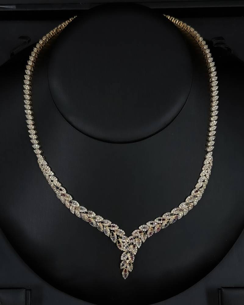 Gold accessory set studded with colored stones