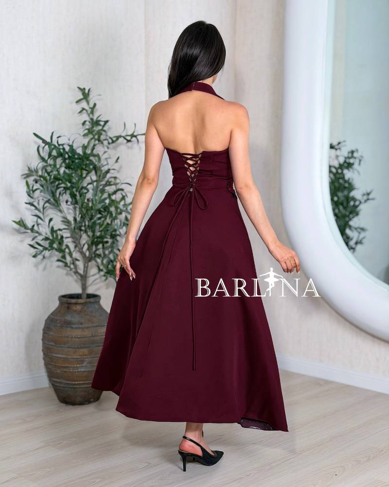 Burgundy evening dress with a wide cut and black embroidery