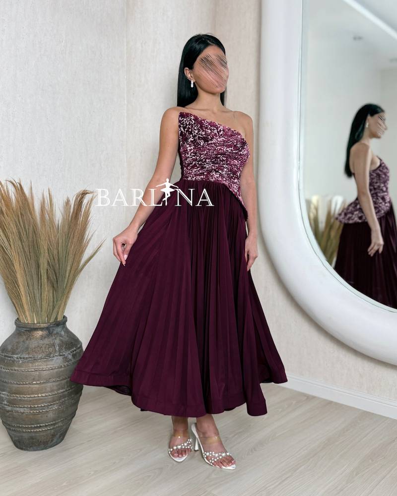 A soft burgundy dress with an elegant embroidered bodice