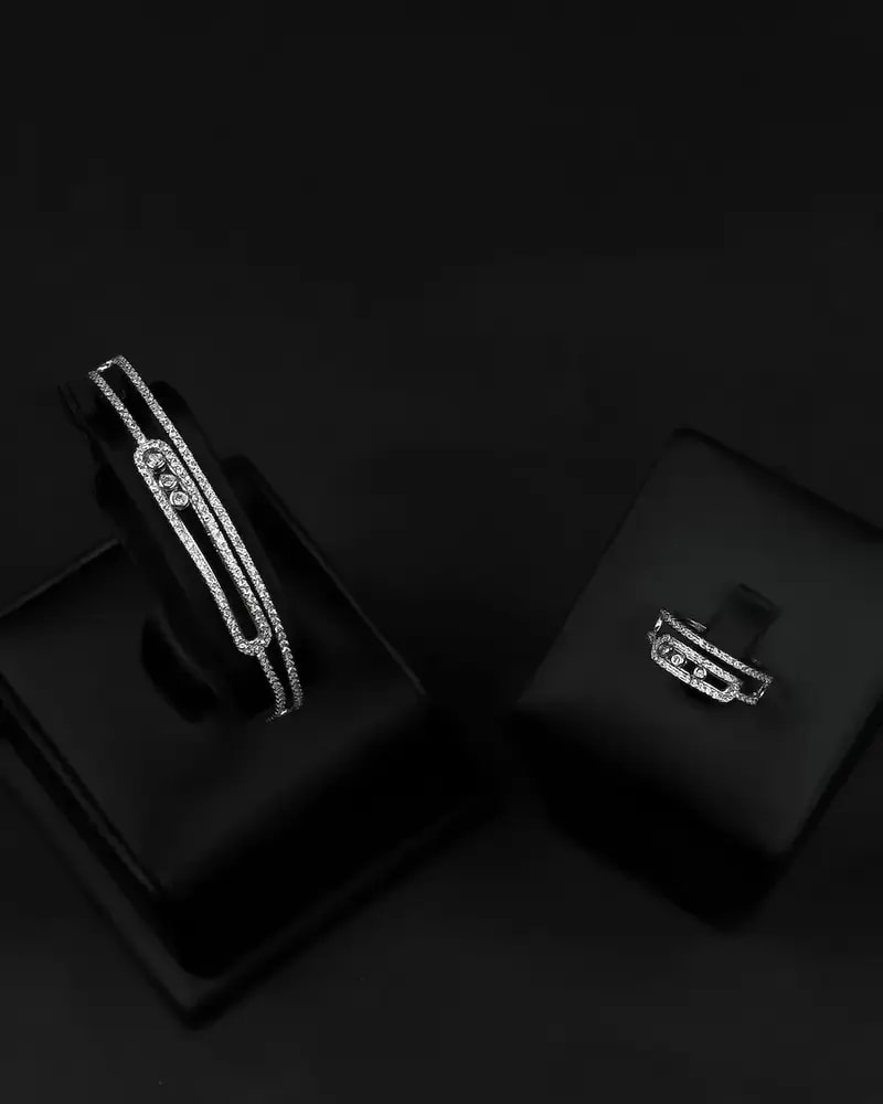 Bracelet and ring with a double zircon design