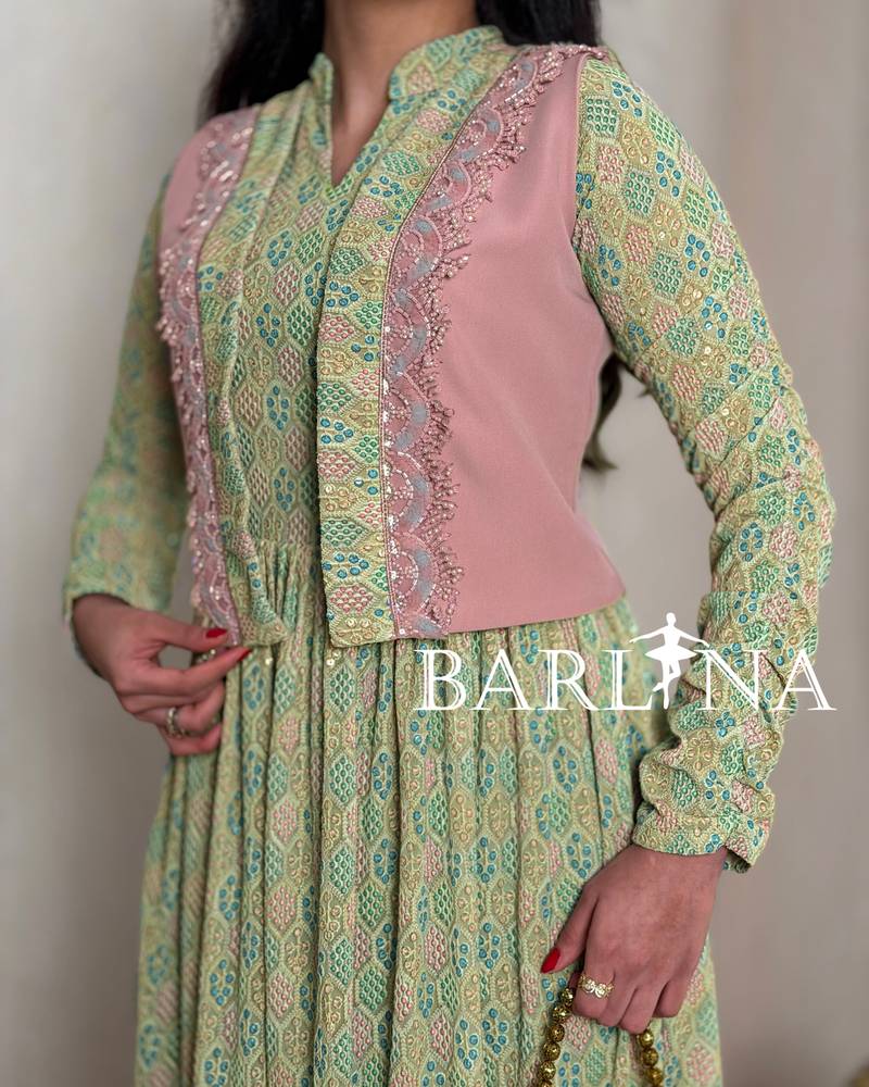 Green patterned jalabiya with a pink jacket