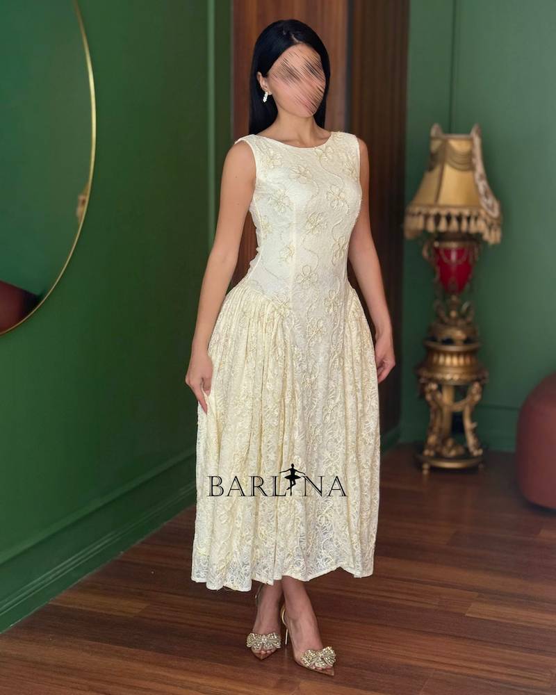 Soft off-white lace dress with a simple neckline