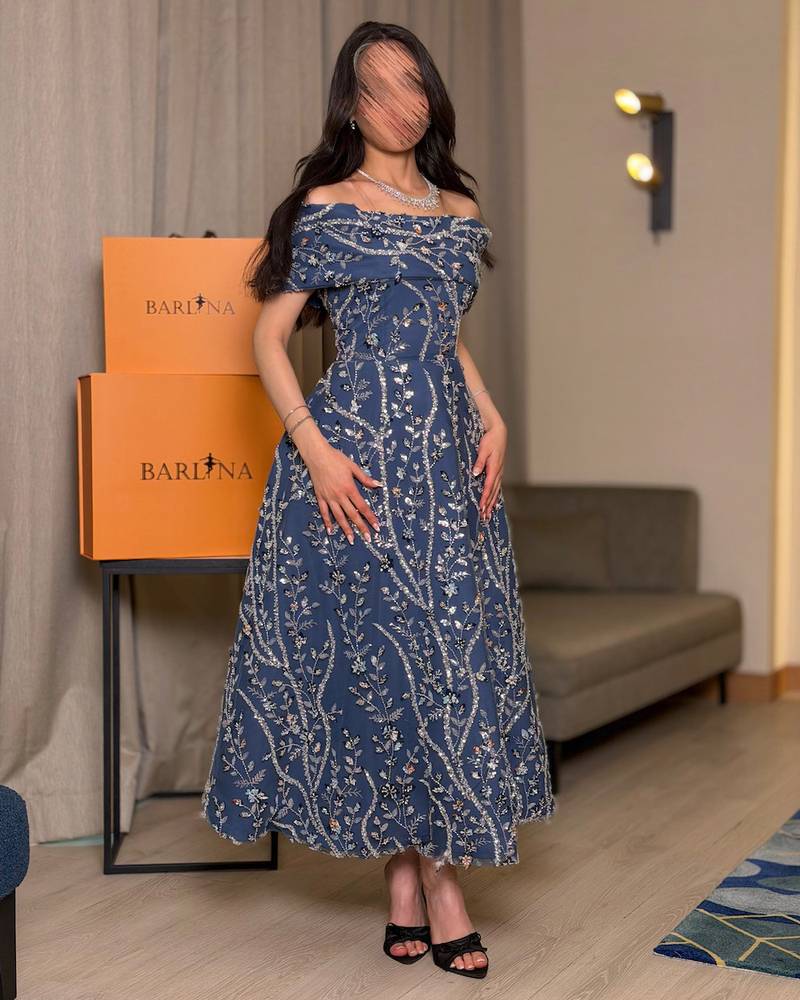 Midi dress embroidered with shimmering botanical patterns