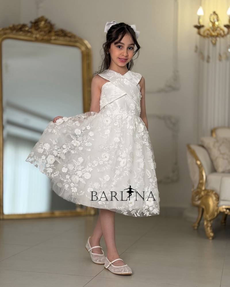 Soft white girls' dress with a cross-neck