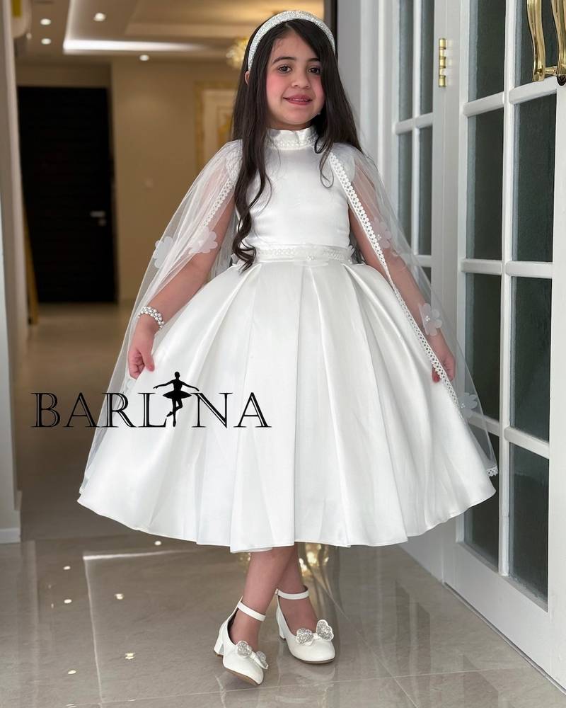 White girl's dress with cape sleeves and embroidered roses