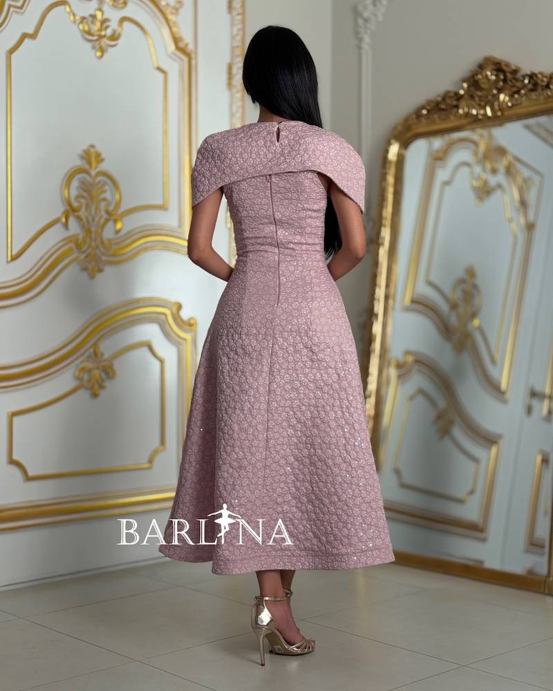 Pink dress with an off-the-shoulder design and decorated with roses