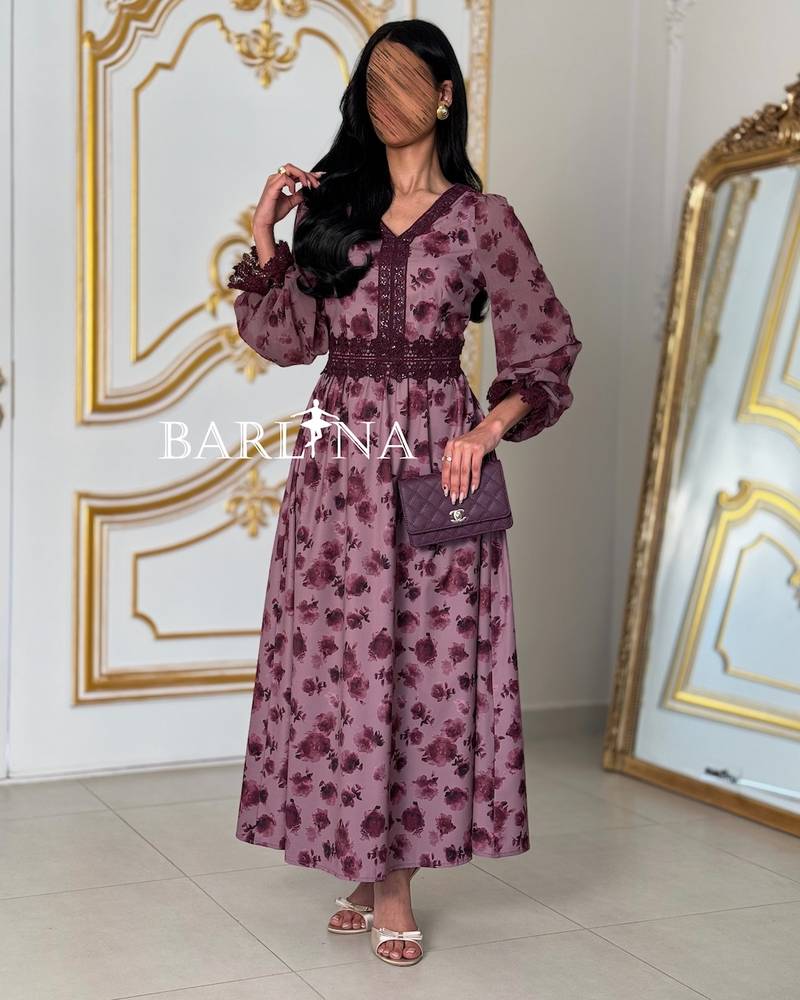 A mauve dress with a floral print and crochet details