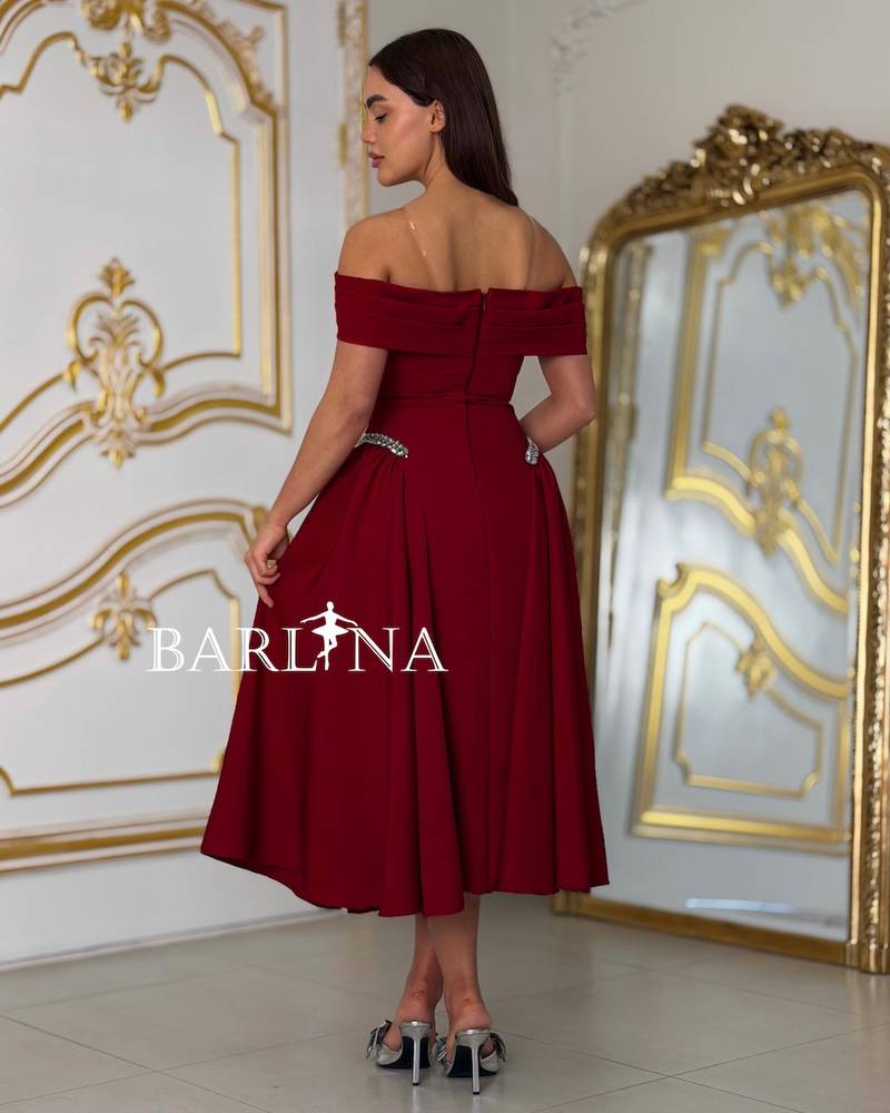 Burgundy off-shoulder dress with a feminine cut