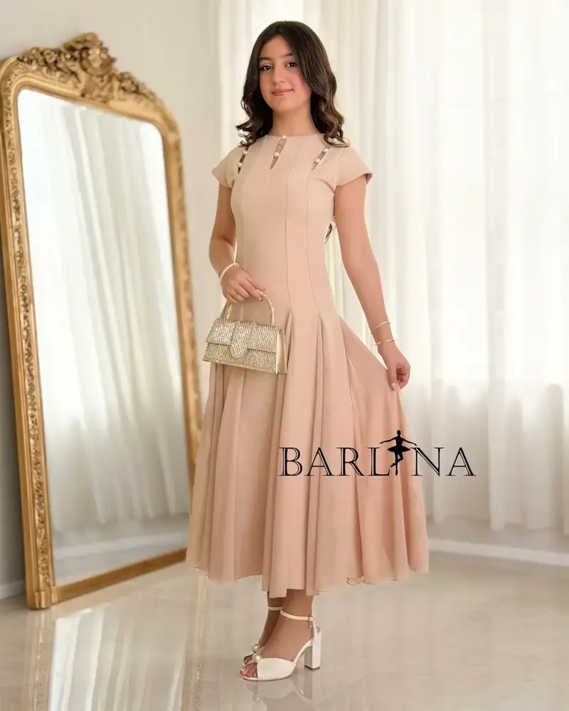 Elegant nude dress adorned with pearl details