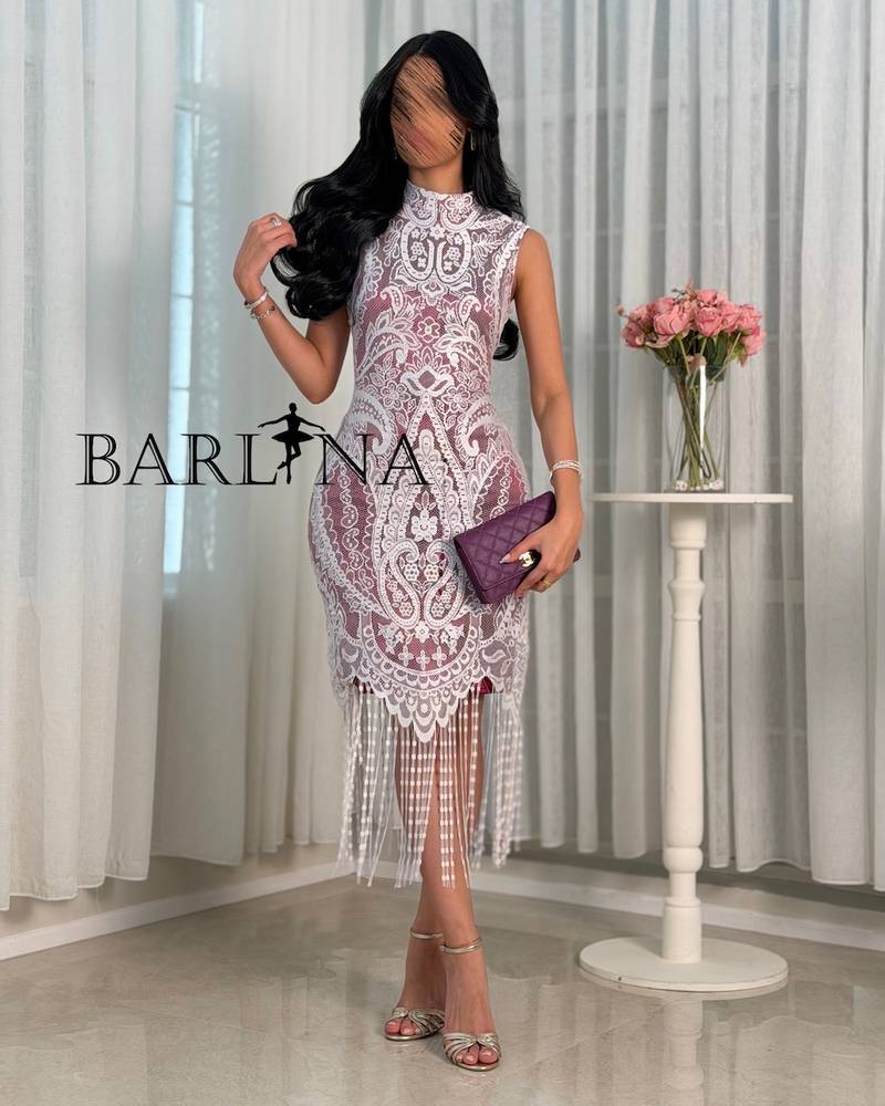 White dress with lined fabric and draped hem