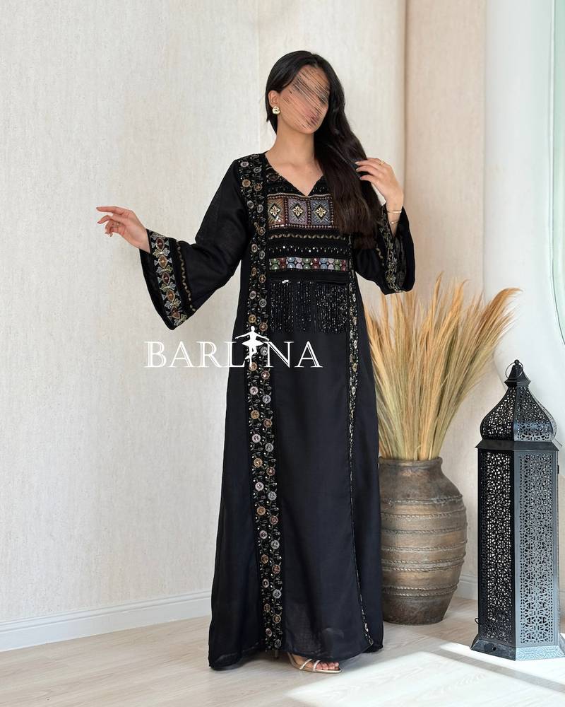 A soft black jalabiya with embroidered edges