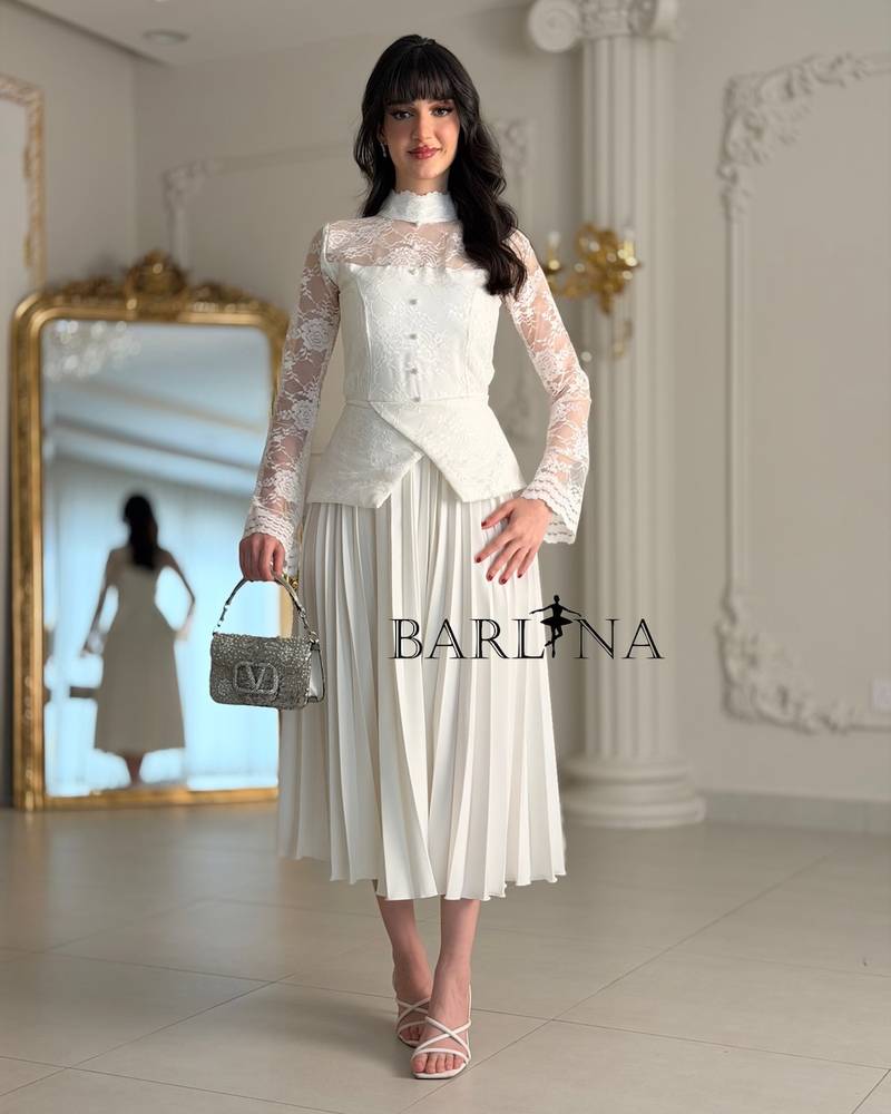 White dress with lace and soft pleats