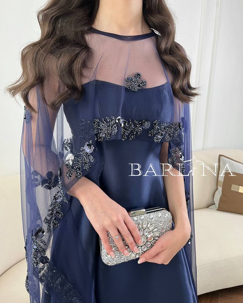 Long navy blue evening dress with a transparent cape