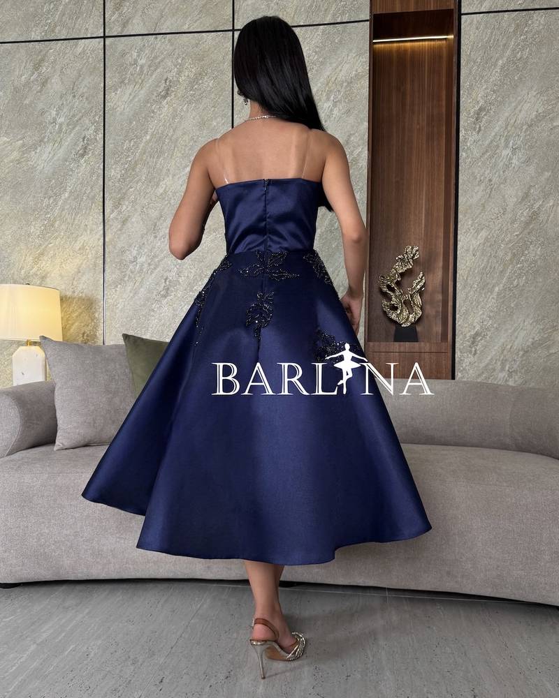 Navy blue off-the-shoulder dress with luxurious embroidery