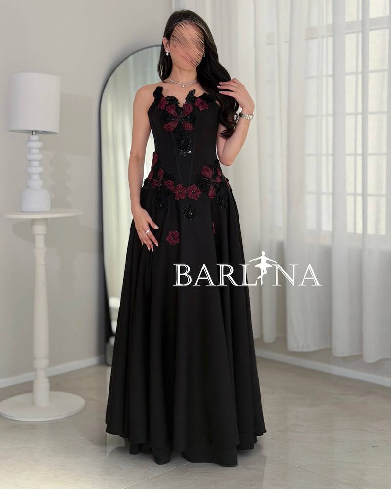 Long black evening dress with an elegant corset cut