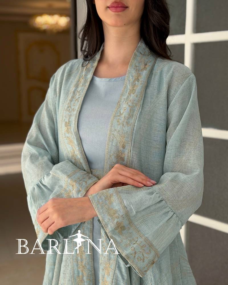 A soft jalabiya with an outer abaya featuring a gold pattern