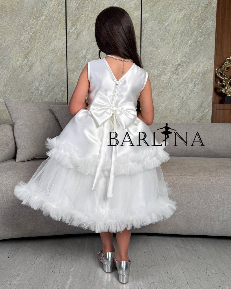 Girls' white dress with embroidery and ruffle details