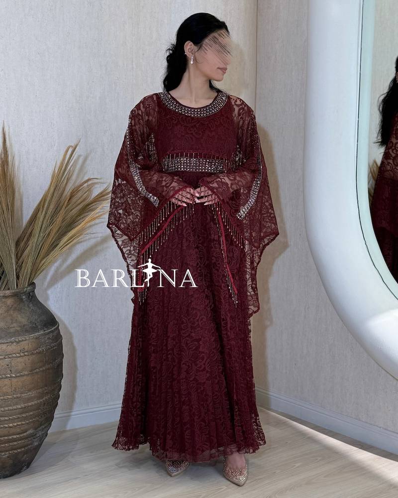 Burgundy lace dress with a wide sheer cape