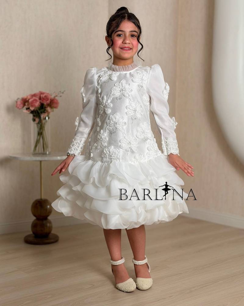 A white girl's dress decorated with raised roses