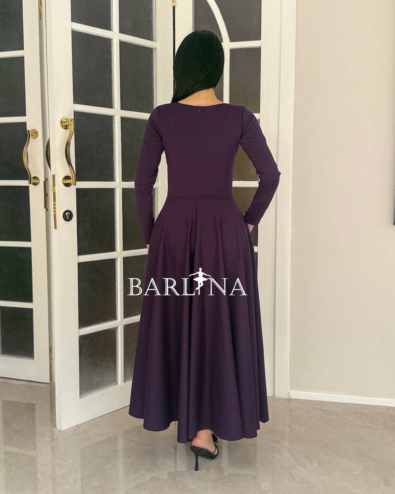 A dark purple dress with an elegant and soft design