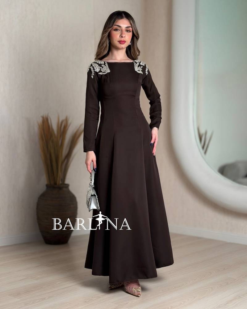 Dark brown dress with embroidery on the shoulders