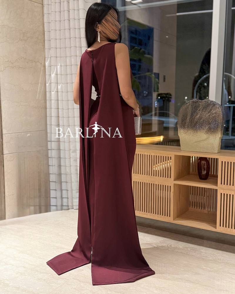 A luxurious burgundy dress with shimmering details