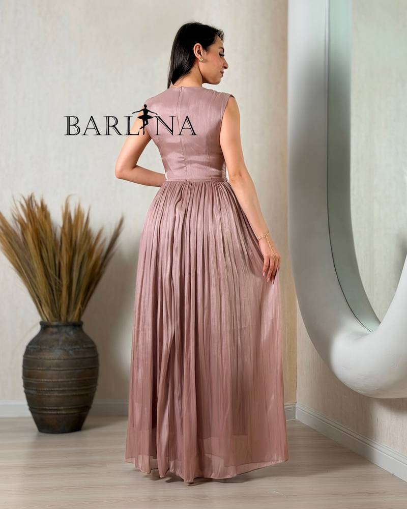 Elegant pink dress adorned with a rose and pleats