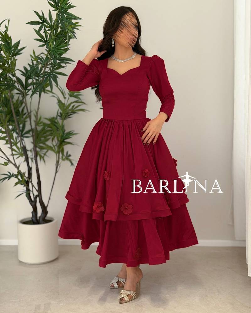 A burgundy mid-length dress with a sweetheart neckline