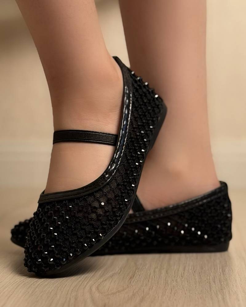Soft girls' shoes adorned with sparkling crystals