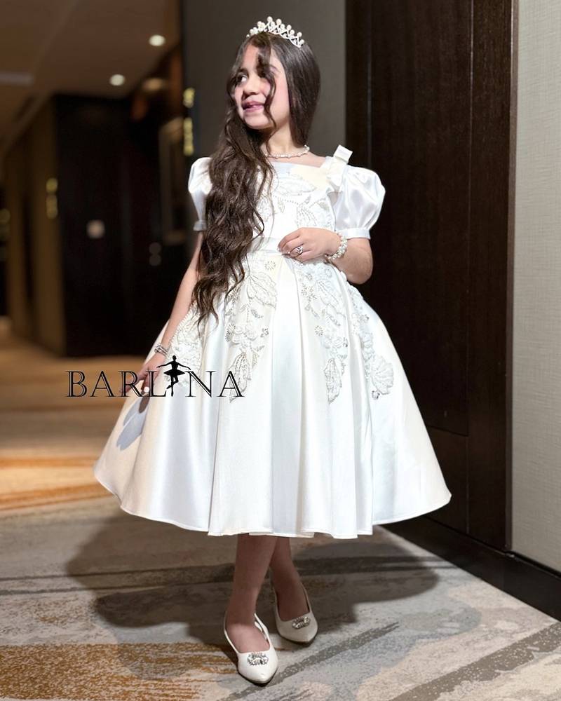 White girl's dress with embroidery on the chest