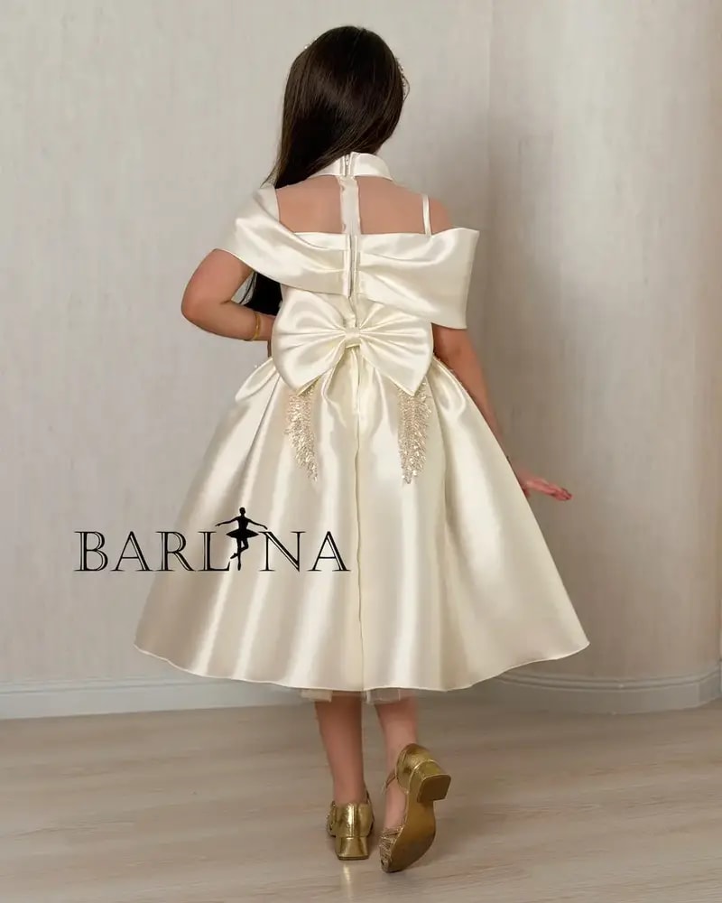 Beige girls' dress with a luxurious design and elegant embroidery