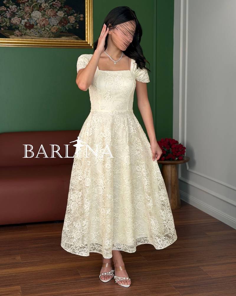 A dress made of soft off-white lace