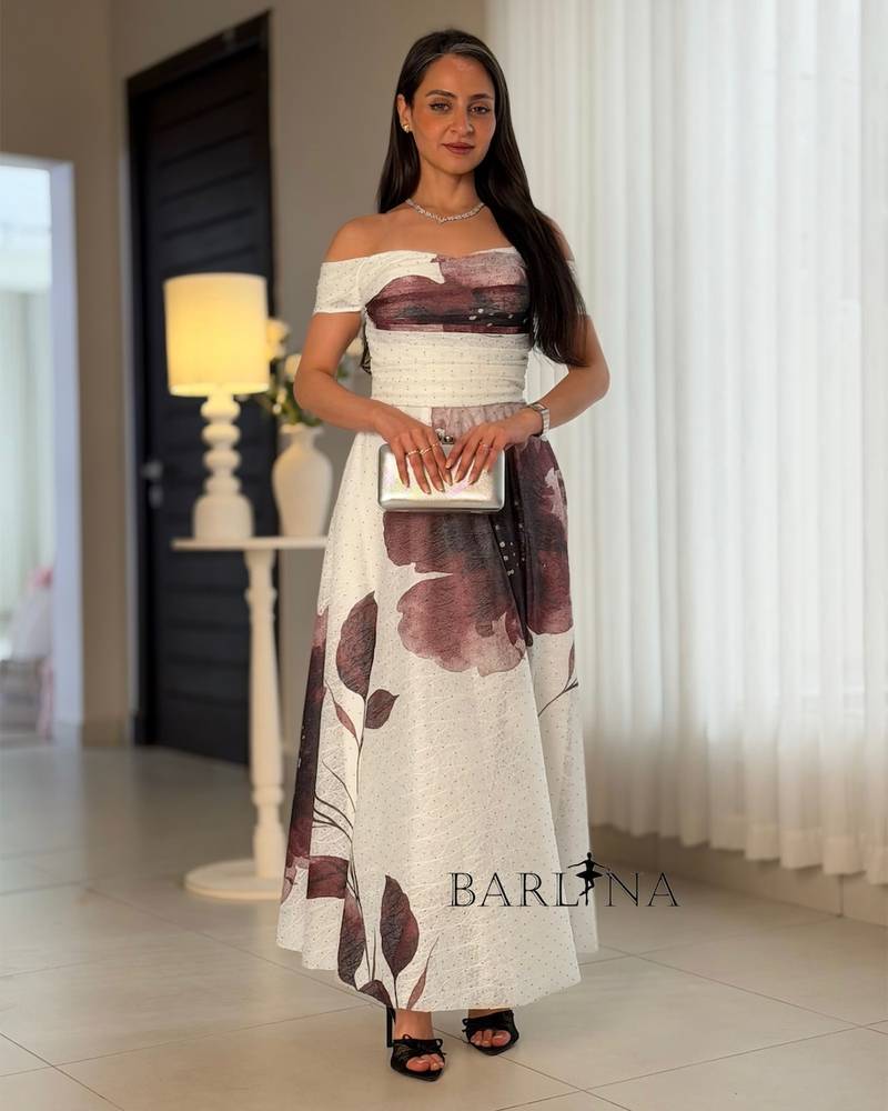 Off-white dress with a purple floral print