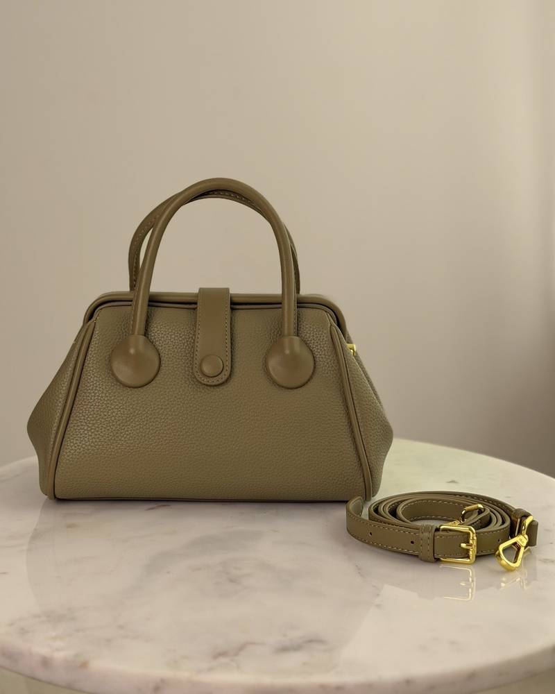 Handbag with a sleek design and stylish top handle