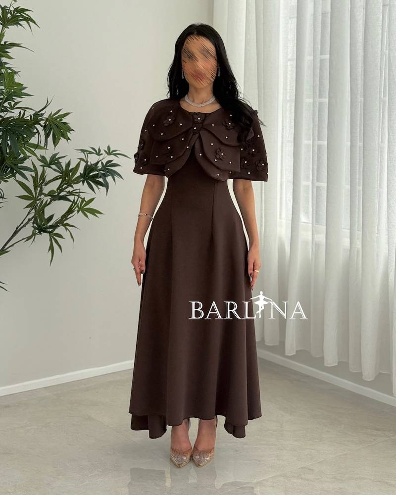Elegant brown dress with a short cape top