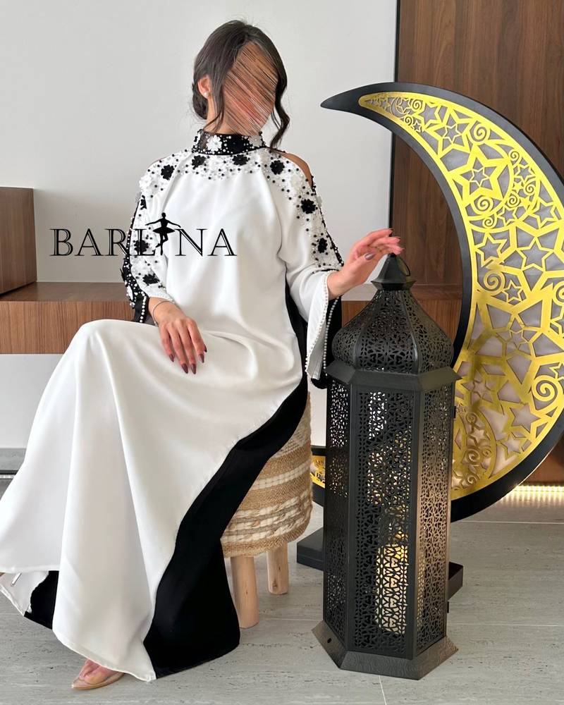 Black and white jalabiya with embroidery on the sleeves