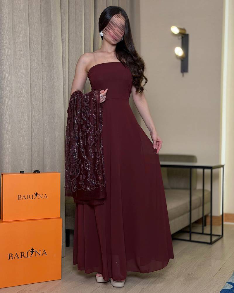 Elegant burgundy dress with a sheer embroidered panel.