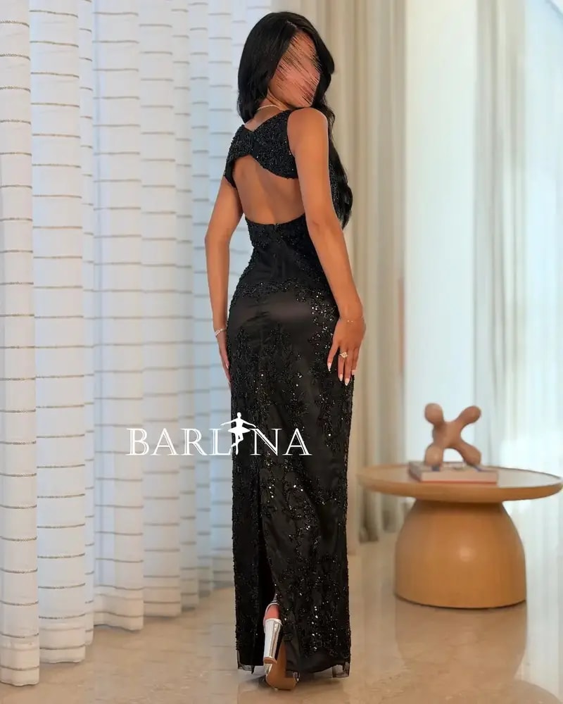 Black fully embroidered dress with a back cut-out