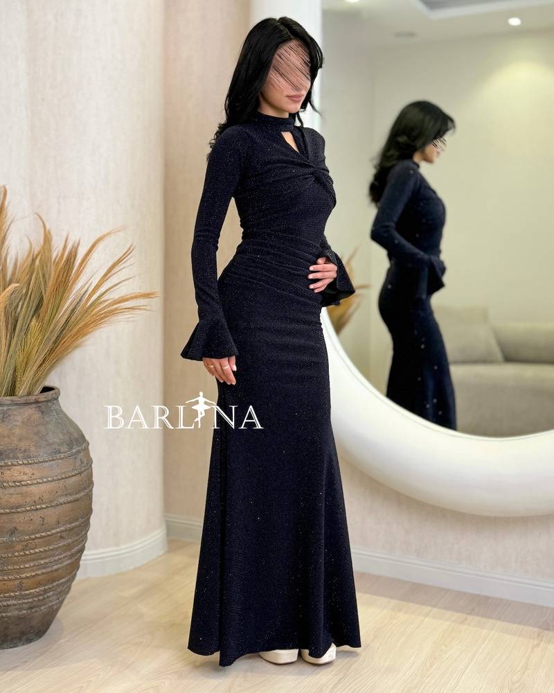 A shiny navy blue dress with wide sleeves at the cuffs