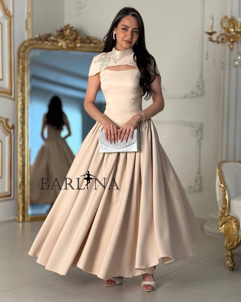 Beige flowing dress with a soft slit at the chest