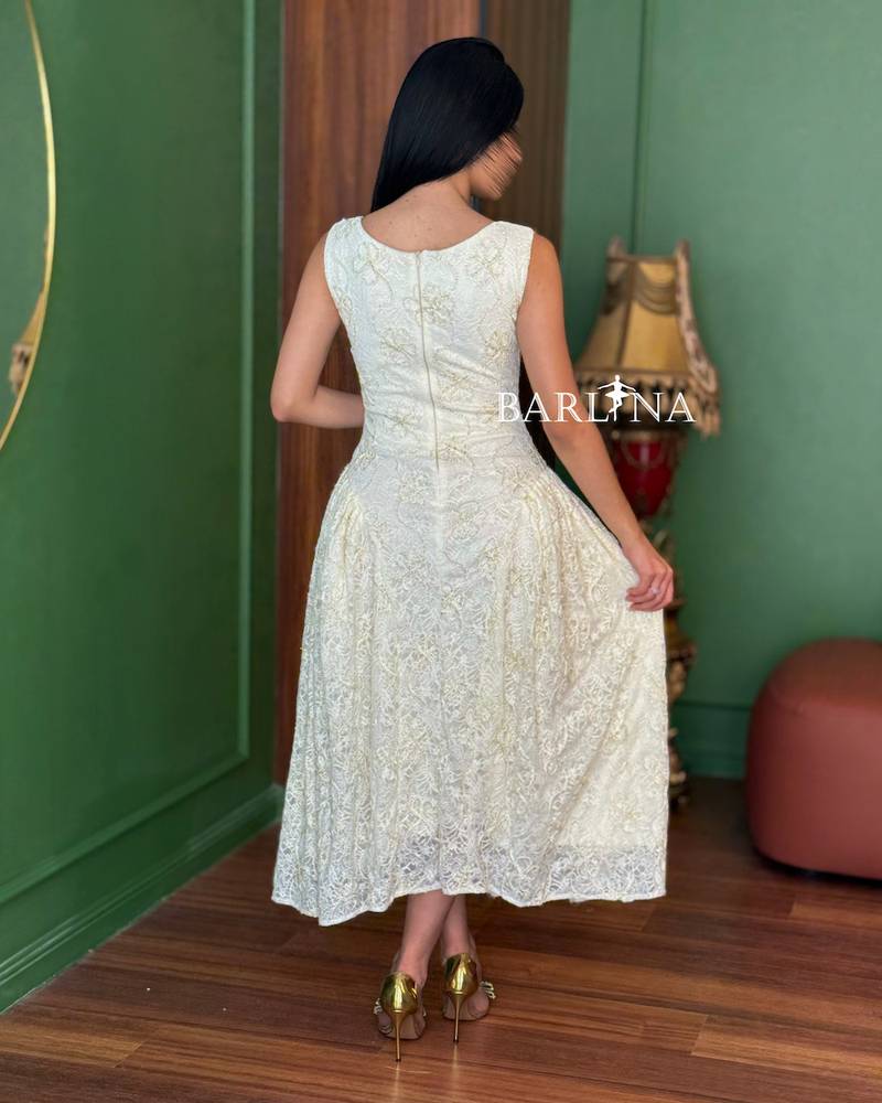 Soft off-white lace dress with a simple neckline